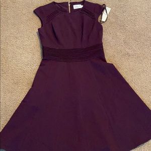 A dark purple dress.